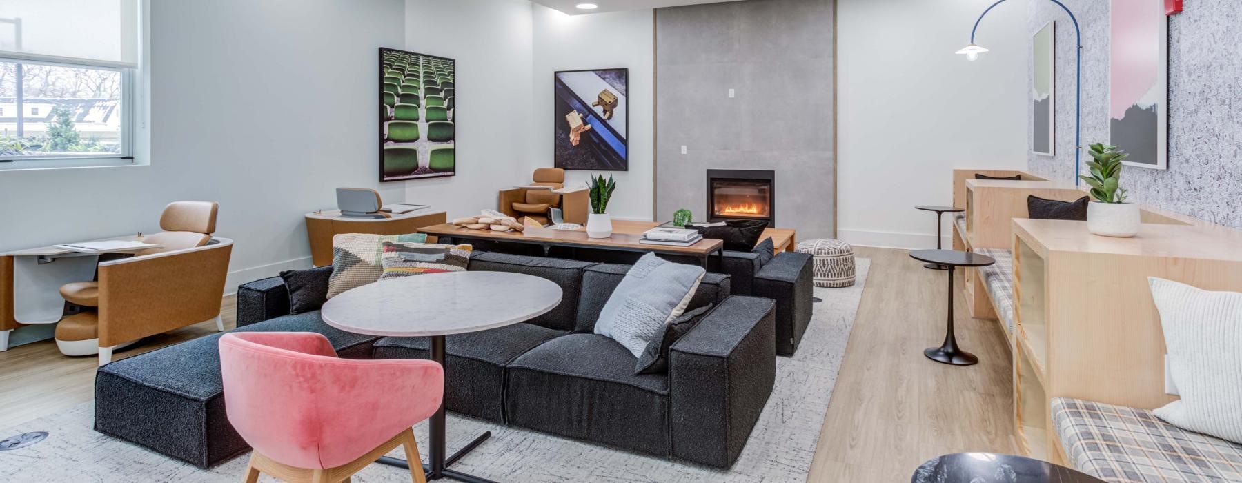 a room with a couch and chairs