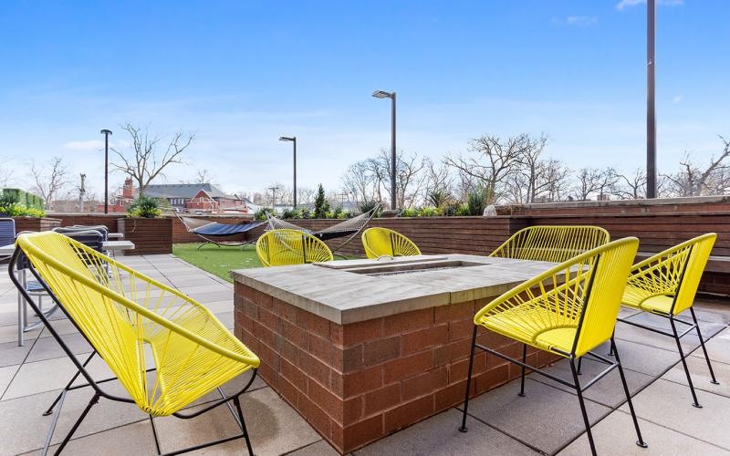 a deck with chairs and a table